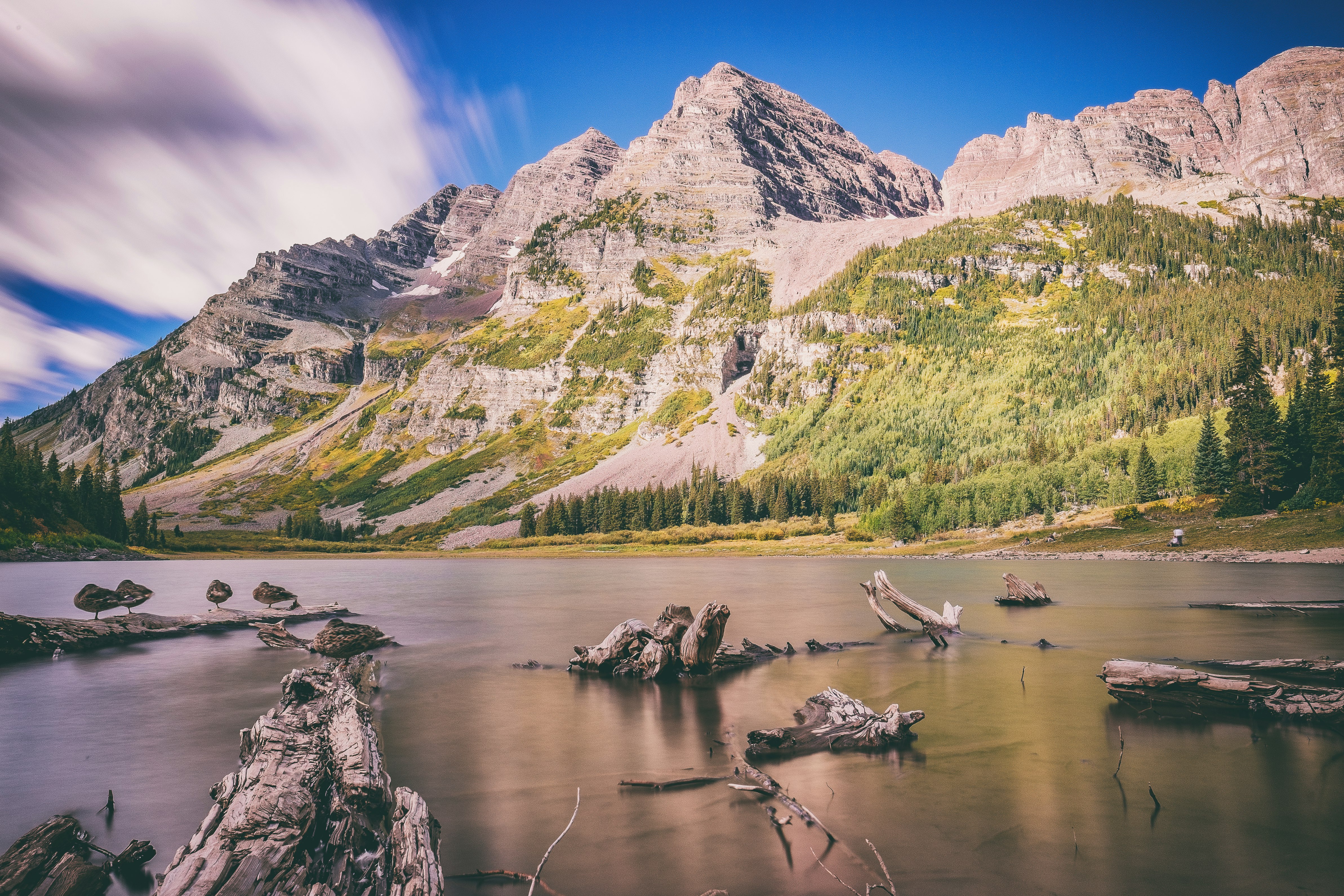 landscape photography of mountains near body of water